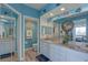 Bathroom with a double vanity, light blue walls, and granite countertops at 1200 Country Club Dr # 2504, Largo, FL 33771