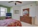 Bedroom with a dresser, TV, and a ceiling fan at 1200 Country Club Dr # 2504, Largo, FL 33771