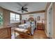 Bedroom with wood floors and a floral comforter set at 1200 Country Club Dr # 2504, Largo, FL 33771