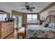 Bright bedroom with wood floors, large windows, and a comfy bed at 1200 Country Club Dr # 2504, Largo, FL 33771