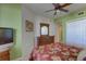 Bedroom with a large dresser, double door closet, and ceiling fan at 1200 Country Club Dr # 2504, Largo, FL 33771