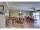 Bright dining area with hardwood floors and wicker furniture at 1200 Country Club Dr # 2504, Largo, FL 33771