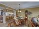 Dining room with wicker furniture and view of kitchen at 1200 Country Club Dr # 2504, Largo, FL 33771