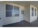Condo entryway with white door and windows at 1200 Country Club Dr # 2504, Largo, FL 33771