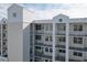 Condo building exterior showcasing balconies and building features at 1200 Country Club Dr # 2504, Largo, FL 33771