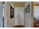 Interior hallway with door and book shelf at 1200 Country Club Dr # 2504, Largo, FL 33771