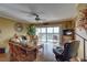 Living room with hardwood floors, golf course view, and wicker furniture at 1200 Country Club Dr # 2504, Largo, FL 33771
