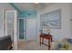 Bright office space with a desk, comfortable chair, and large artwork at 1200 Country Club Dr # 2504, Largo, FL 33771