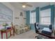 Home office with a sofa, desk, and ocean-themed decor at 1200 Country Club Dr # 2504, Largo, FL 33771