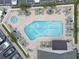 Aerial view of refreshing pool and spacious sundeck with lounge chairs at 1200 Country Club Dr # 2504, Largo, FL 33771