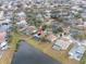 A great community, this aerial view showcases the home's location near a lake and other community homes at 1515 Lions Club Dr, Brandon, FL 33511