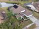 Aerial view of a beautiful home with a well-manicured lawn and lush landscaping and a backyard pool area at 1515 Lions Club Dr, Brandon, FL 33511