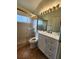 Bright bathroom featuring a glass-enclosed shower and modern vanity at 1515 Lions Club Dr, Brandon, FL 33511
