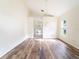 Bedroom showcasing wood flooring, ensuite bathroom and abundant natural light at 1515 Lions Club Dr, Brandon, FL 33511