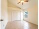 Bedroom with tile floors, a window, and a double-door closet at 1515 Lions Club Dr, Brandon, FL 33511