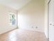 Clean and bright bedroom with tiled floors and a neutral color scheme at 1515 Lions Club Dr, Brandon, FL 33511