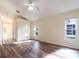 Inviting bedroom featuring wood floors, ensuite bathroom and bright natural light at 1515 Lions Club Dr, Brandon, FL 33511