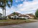 Charming single-story home with a well-manicured lawn and a two-car garage in a suburban neighborhood at 1515 Lions Club Dr, Brandon, FL 33511