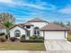 Single-story home with a two-car garage and well-manicured lawn at 1515 Lions Club Dr, Brandon, FL 33511