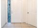Welcoming front door with a stylish mosaic sidelight window and light tile flooring at 1515 Lions Club Dr, Brandon, FL 33511