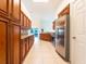 Open kitchen featuring wood cabinets, stainless steel appliances, and granite countertops at 1515 Lions Club Dr, Brandon, FL 33511
