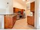 Well-equipped kitchen featuring wood cabinets, stainless steel appliances, and granite countertops at 1515 Lions Club Dr, Brandon, FL 33511