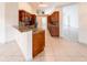 Open kitchen with wood cabinets, stainless steel appliances, and granite countertops at 1515 Lions Club Dr, Brandon, FL 33511
