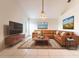 Cozy living room with a large leather sectional and stylish décor at 1515 Lions Club Dr, Brandon, FL 33511