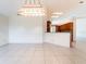 Bright living room space featuring tile floors and an open view to the kitchen at 1515 Lions Club Dr, Brandon, FL 33511
