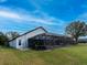 This home features a beautiful screened-in patio and a well-maintained lawn, ideal for relaxation at 1515 Lions Club Dr, Brandon, FL 33511