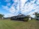 Expansive backyard with a screened-in patio, perfect for entertaining and enjoying the outdoors at 1515 Lions Club Dr, Brandon, FL 33511