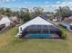 Back of house with screened in pool and nice landscaping at 1515 Lions Club Dr, Brandon, FL 33511