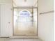 Bathroom featuring a glass enclosed shower with seating and modern fixtures at 1515 Lions Club Dr, Brandon, FL 33511