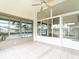 Enclosed sunroom with tiled floors and backyard views at 1515 Lions Club Dr, Brandon, FL 33511