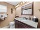 Bathroom with granite countertop, dark brown vanity, and a shower/tub combo at 2168 Cypress Point N Dr, Clearwater, FL 33763