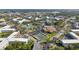 Aerial view of community with pool, tennis courts, and clubhouse at 2262 Swedish Dr # 12, Clearwater, FL 33763