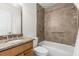 Clean bathroom with tiled shower/tub combo and granite vanity at 2262 Swedish Dr # 12, Clearwater, FL 33763