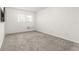 Empty bedroom with neutral-colored carpeting at 2262 Swedish Dr # 12, Clearwater, FL 33763