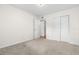 Well-lit bedroom with double doors leading to closet at 2262 Swedish Dr # 12, Clearwater, FL 33763