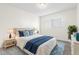 Bright bedroom with a queen-size bed and blue accents at 2262 Swedish Dr # 12, Clearwater, FL 33763