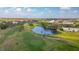 Aerial view of lush green golf course and pond at 2262 Swedish Dr # 12, Clearwater, FL 33763