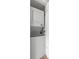 Stackable white washer and dryer in a closet at 2262 Swedish Dr # 12, Clearwater, FL 33763