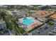 Aerial view of community pool, clubhouse, and surrounding buildings at 2262 Swedish Dr # 12, Clearwater, FL 33763