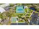Aerial view of community tennis courts and surrounding landscaping at 2262 Swedish Dr # 12, Clearwater, FL 33763