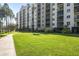 Condo building with a manicured lawn and walkway at 2320 Terra Ceia Bay Blvd # 403, Palmetto, FL 34221