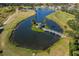 Aerial view of a gazebo on a small island in a pond, with a bridge leading to it at 2320 Terra Ceia Bay Blvd # 403, Palmetto, FL 34221