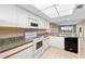View of kitchen with appliances and granite countertops at 2320 Terra Ceia Bay Blvd # 403, Palmetto, FL 34221