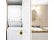 Stackable washer and dryer in a compact laundry area at 2320 Terra Ceia Bay Blvd # 403, Palmetto, FL 34221