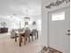 Bright dining room with a wooden table and chairs near the home's entrance at 31371 Cabana Rye Ave, San Antonio, FL 33576