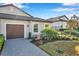 Single-story home with a two-car garage and well-manicured landscaping at 31371 Cabana Rye Ave, San Antonio, FL 33576